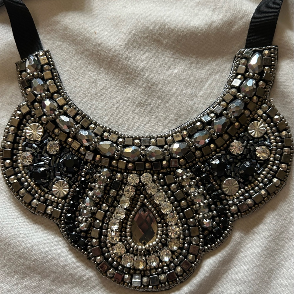 Bib Necklace with black ribbon tie close